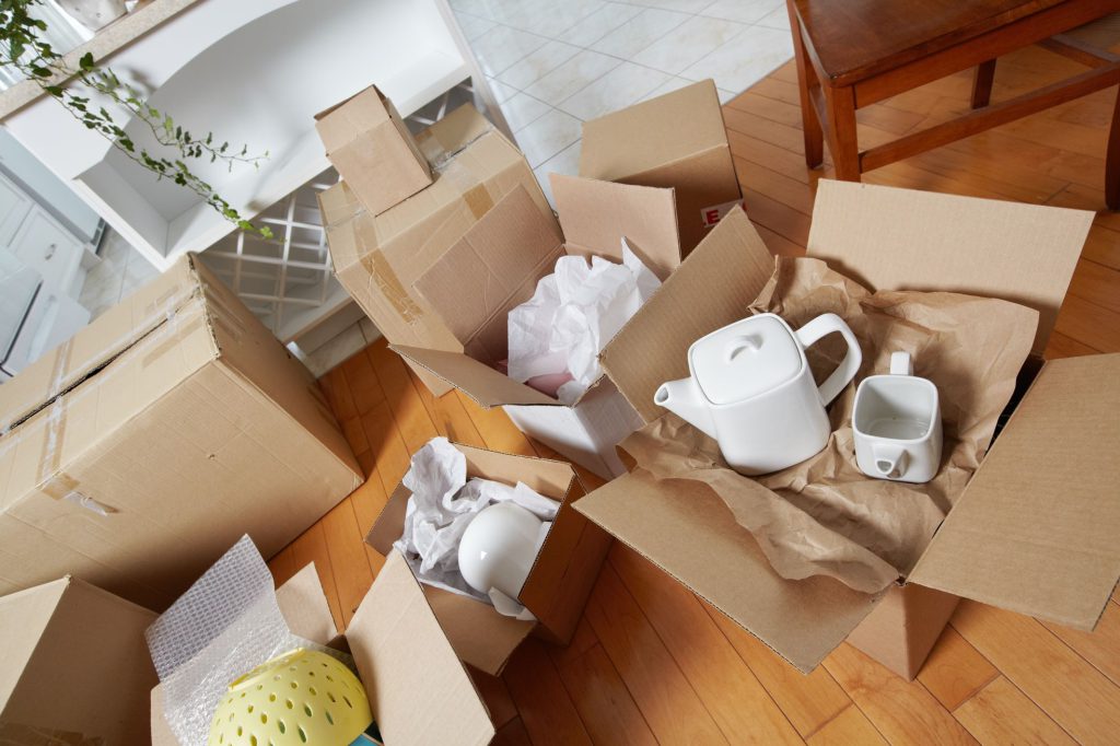 Dishware in boxes on the floor